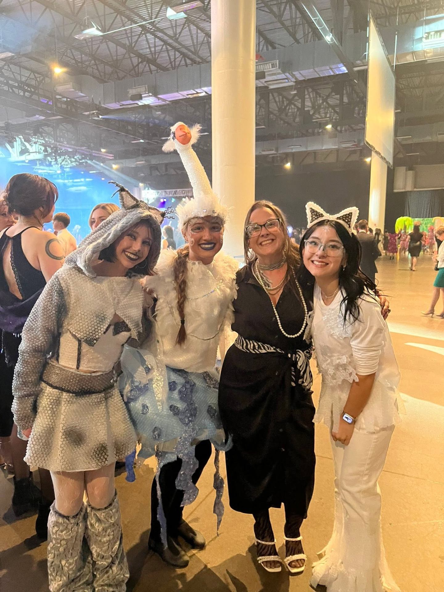 Tiah with a group of themed costume performers at a gala