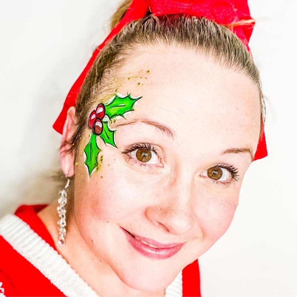 Christmas holly and berries painted above the eye